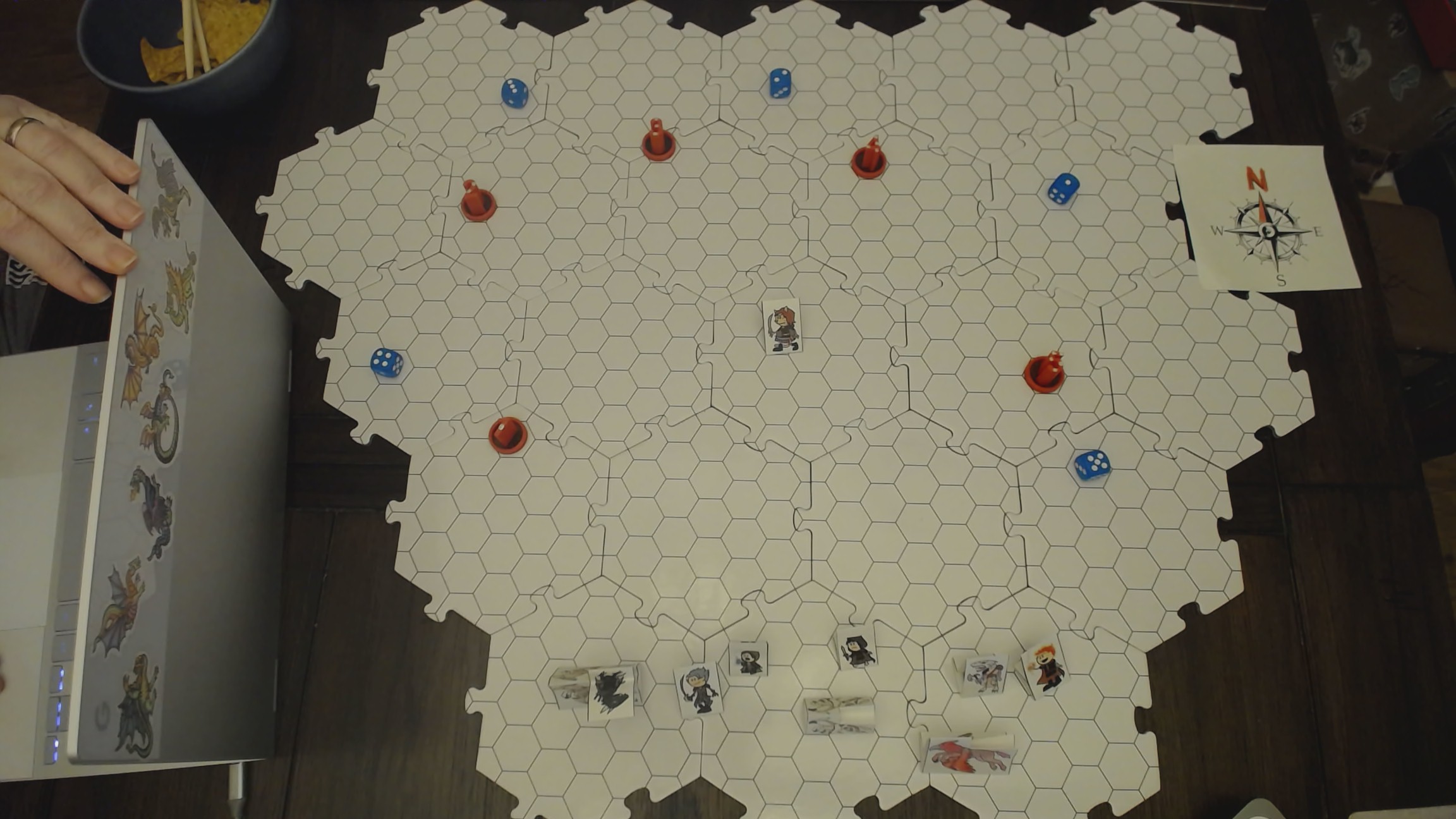 The meadow with Fine Branch in it, and Red tokens for the Knights, and Blue tokens for the swarms of bees. battle map of the field surrounding Fine Branch, with paper tokens for the Freelancers, Red tokens for the Knights, and Blue tokens for the swarms of bees.