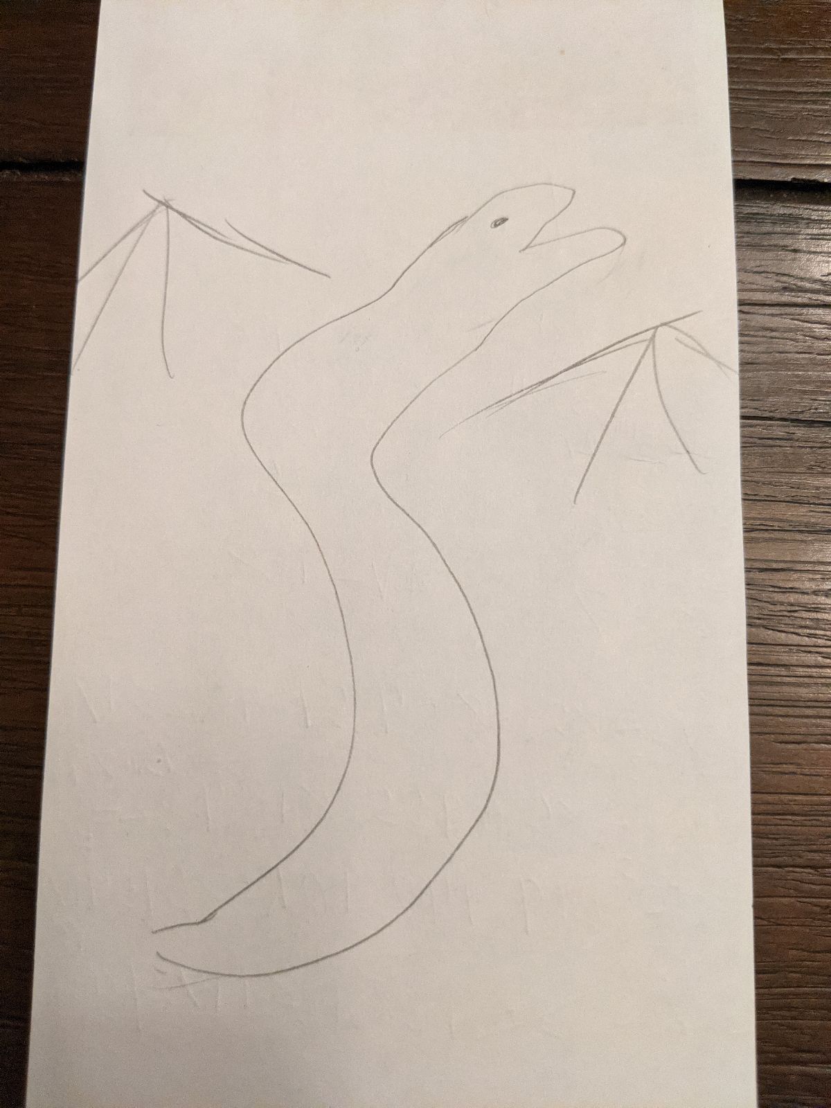 A crude drawing of a snake with wings facing to the right.  Copyright 2021 Clara E Lee.
