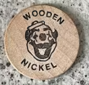 a wooden nickel with a clown on it